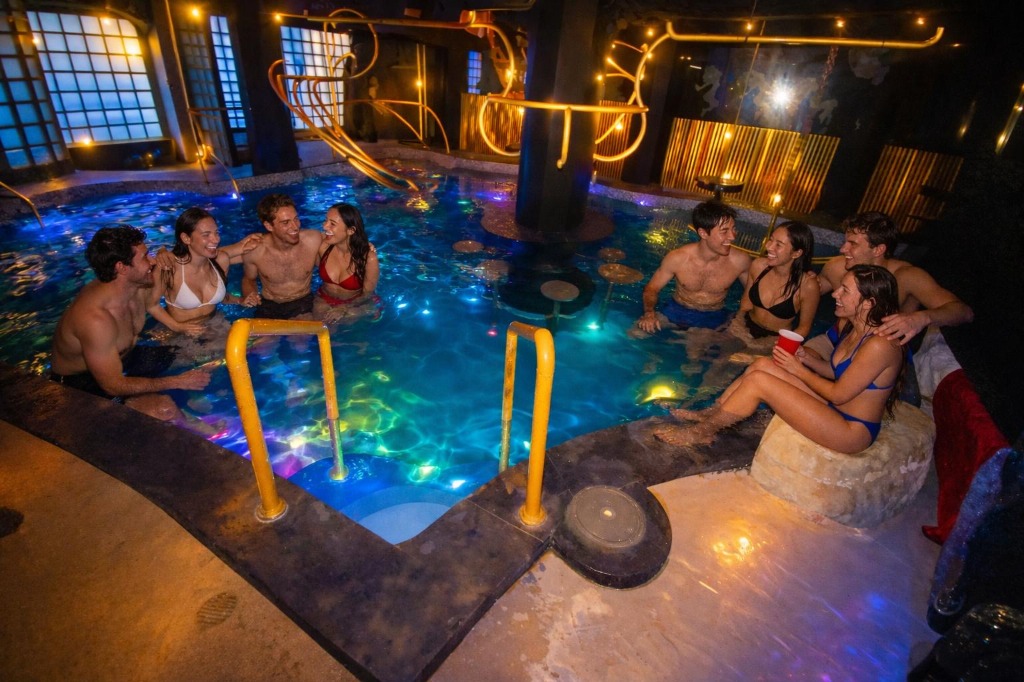 Kohinoor Club unique indoor swimming pool with coloured lights and partying guests